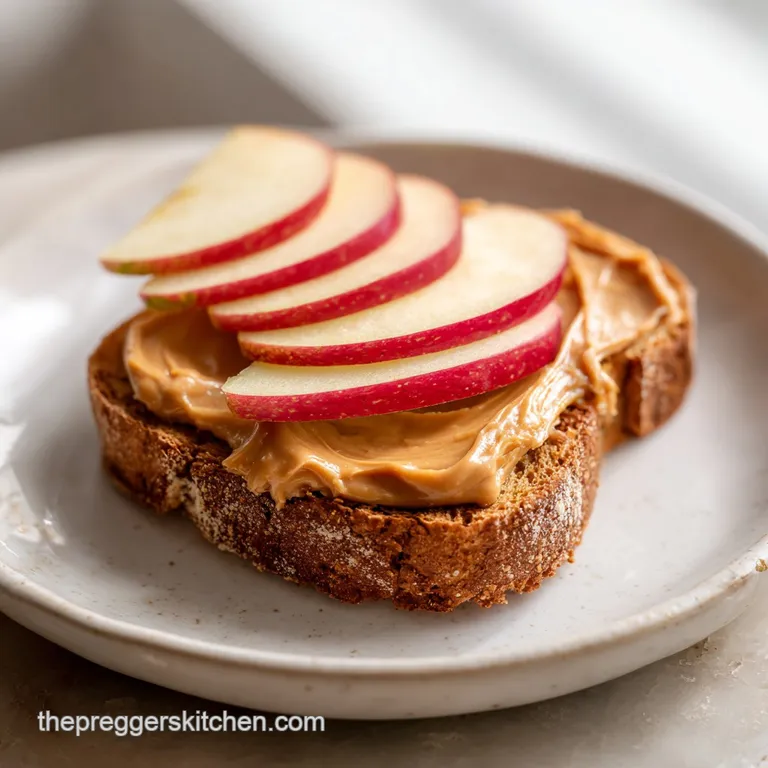 A neat stack of apple slices, each topped with creamy peanut butter and a dusting of seeds, artfully arranged.